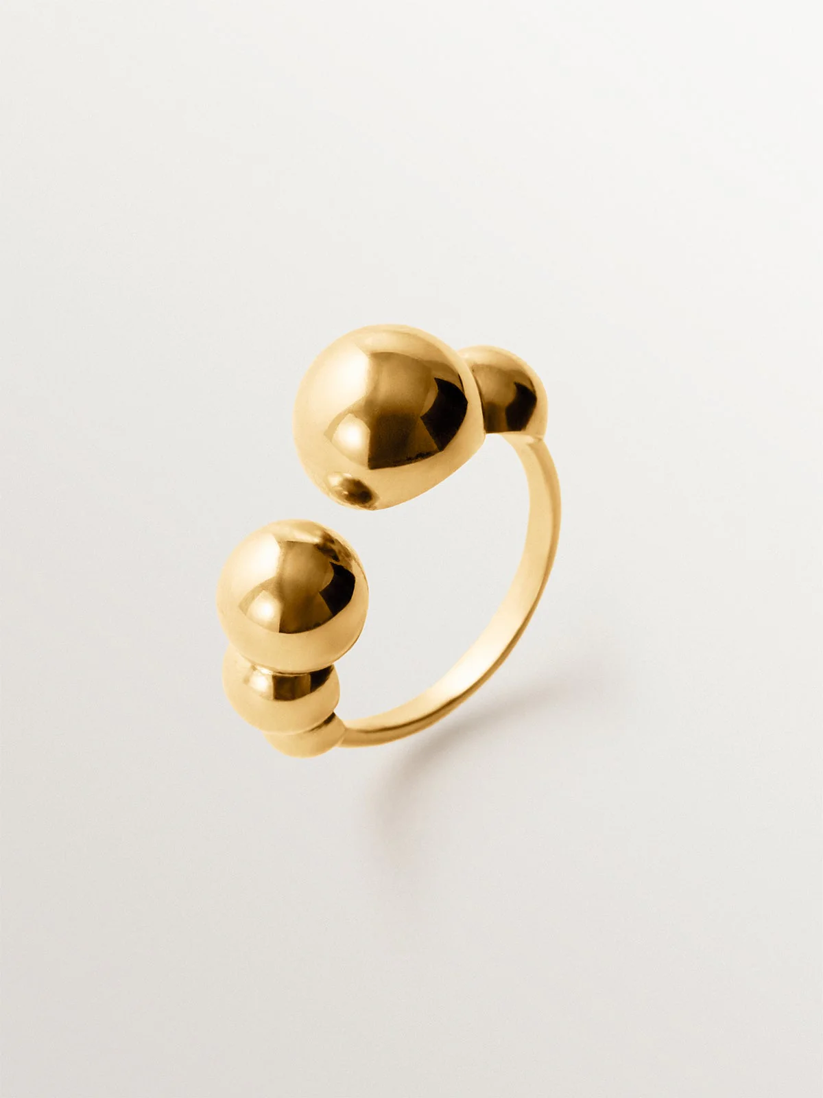 Anillo abierto de plata 925 bañada en oro amarillo de 18K con esferas