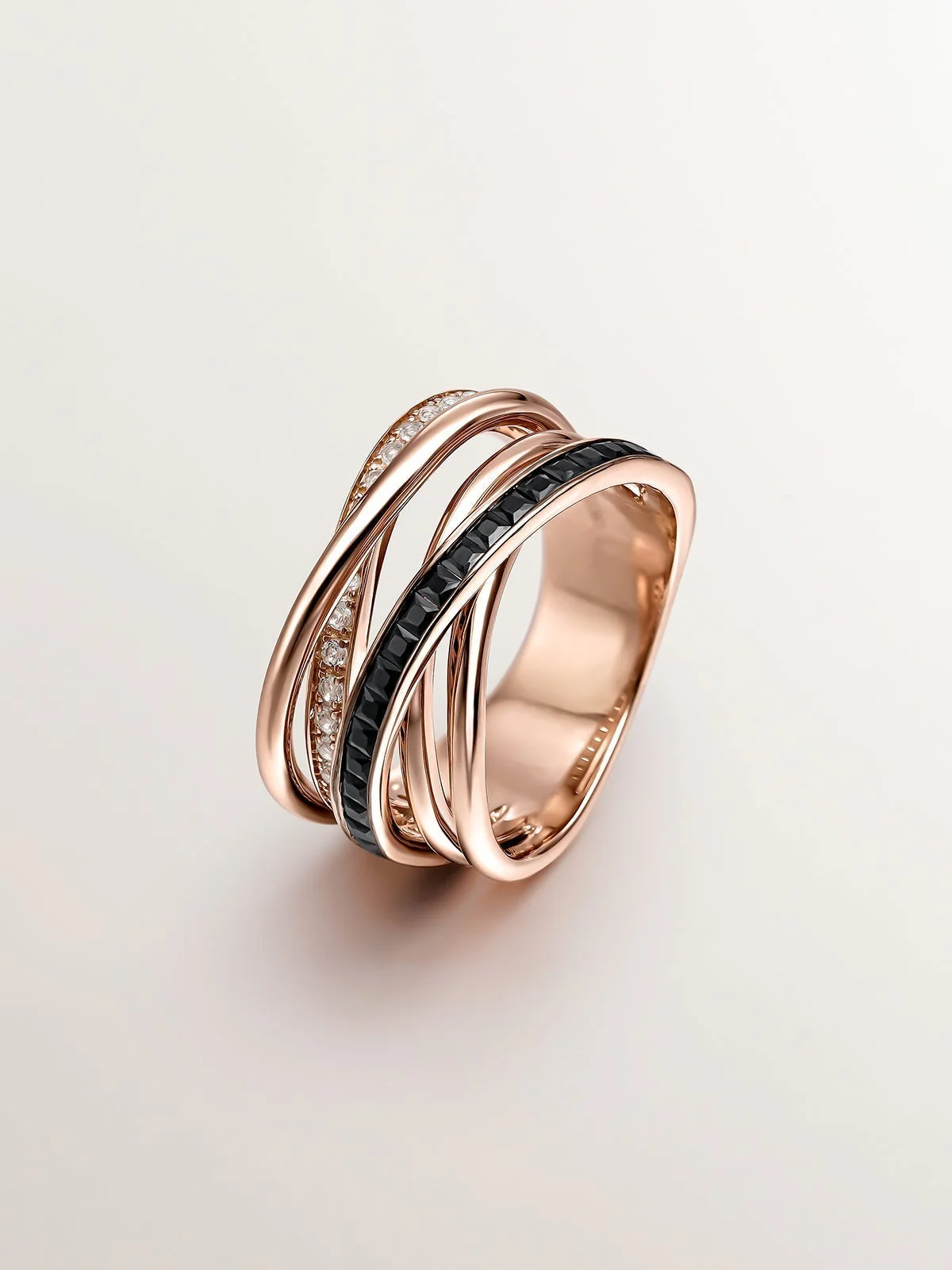 Anillo multibrazo de plata 925 bañada en oro rosa de 18K con topacios blancos y espinelas negras