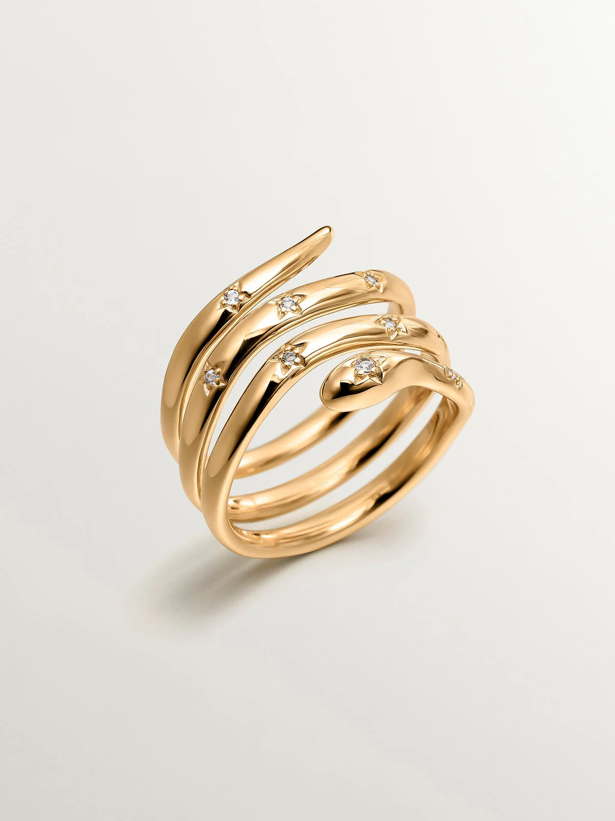 Anillo triple de plata 925 bañada en oro amarillo de 18K con forma de serpiente y topacios blancos