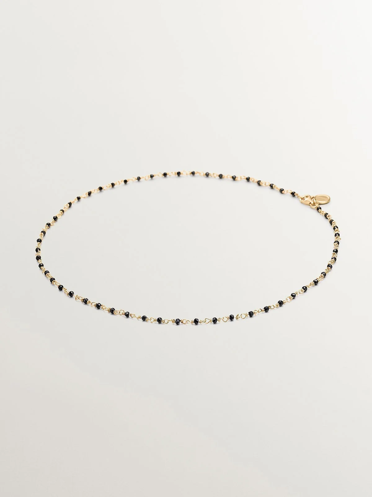 Cadena de plata 925 bañada en oro amarillo 18K con espinelas negras