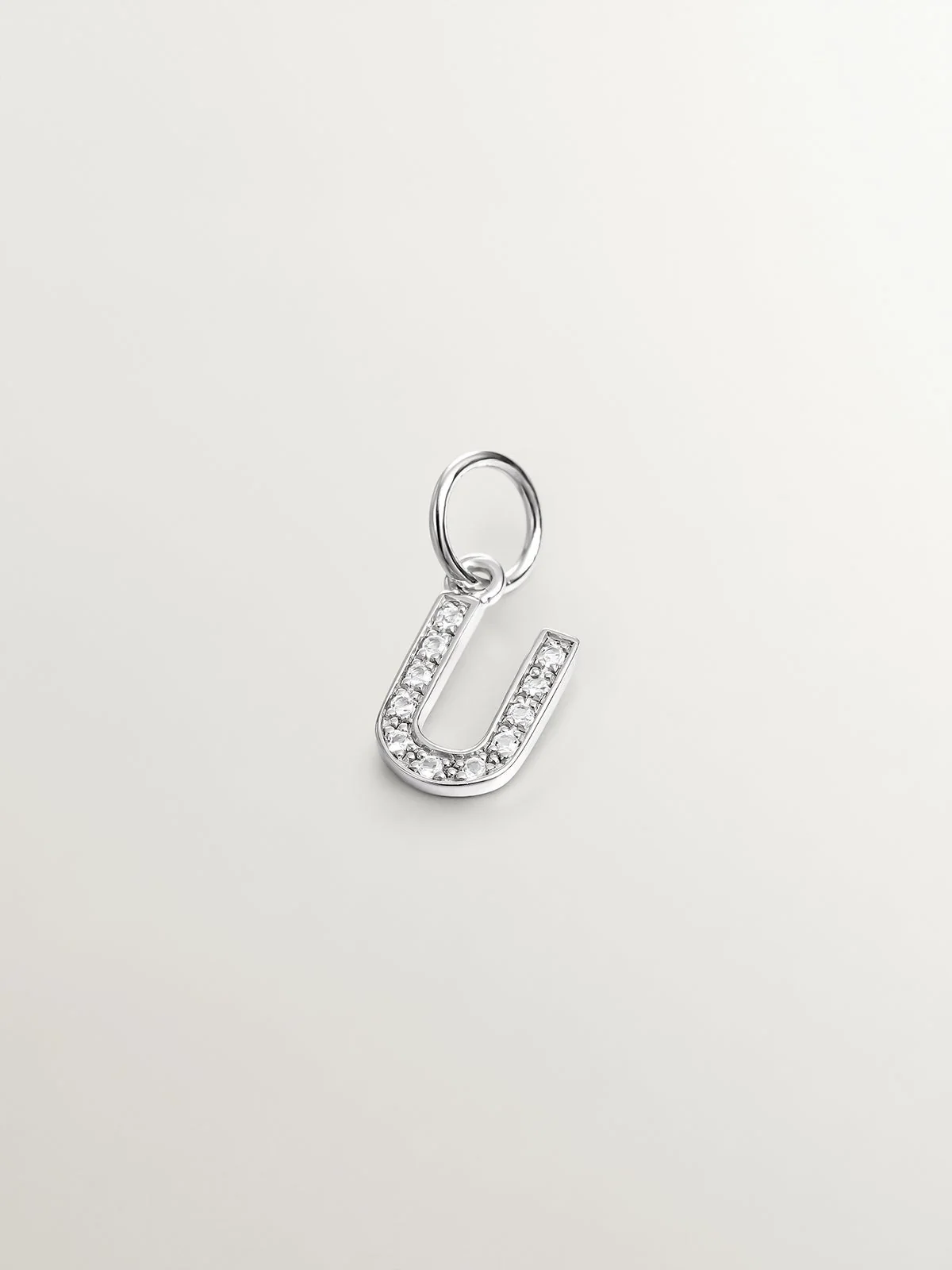 Charm de plata 925 y topacios blancos inicial U