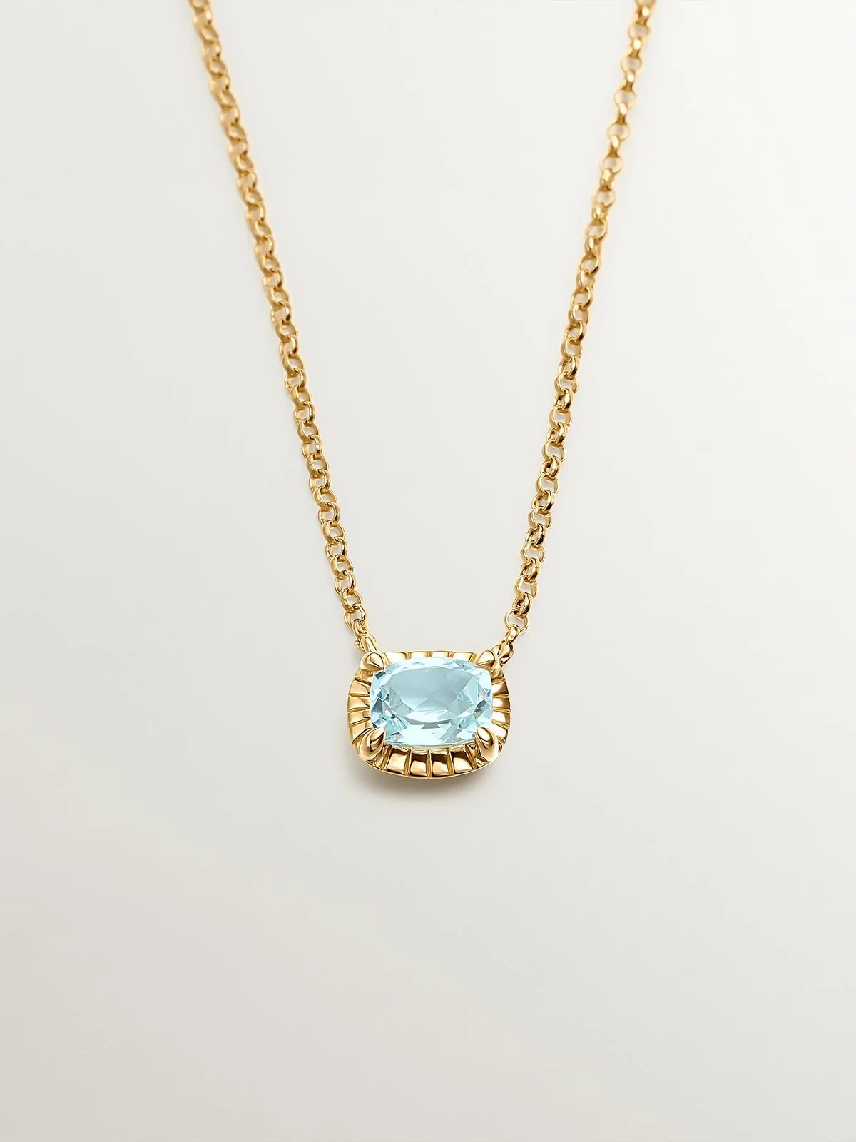 Colgante de plata 925 bañada en oro amarillo de 18K con topacio azul sky