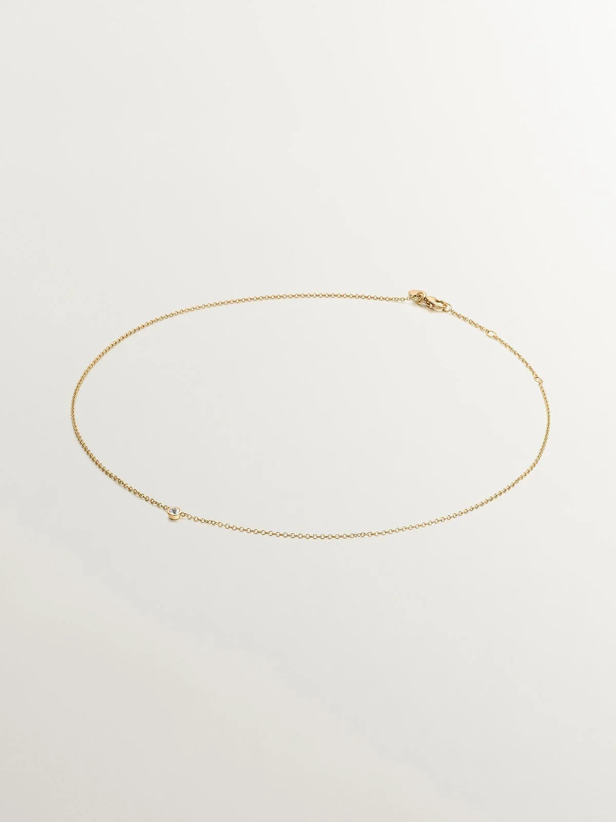 Colgante solitario de plata 925 bañada en oro amarillo de 18K con topacio blanco