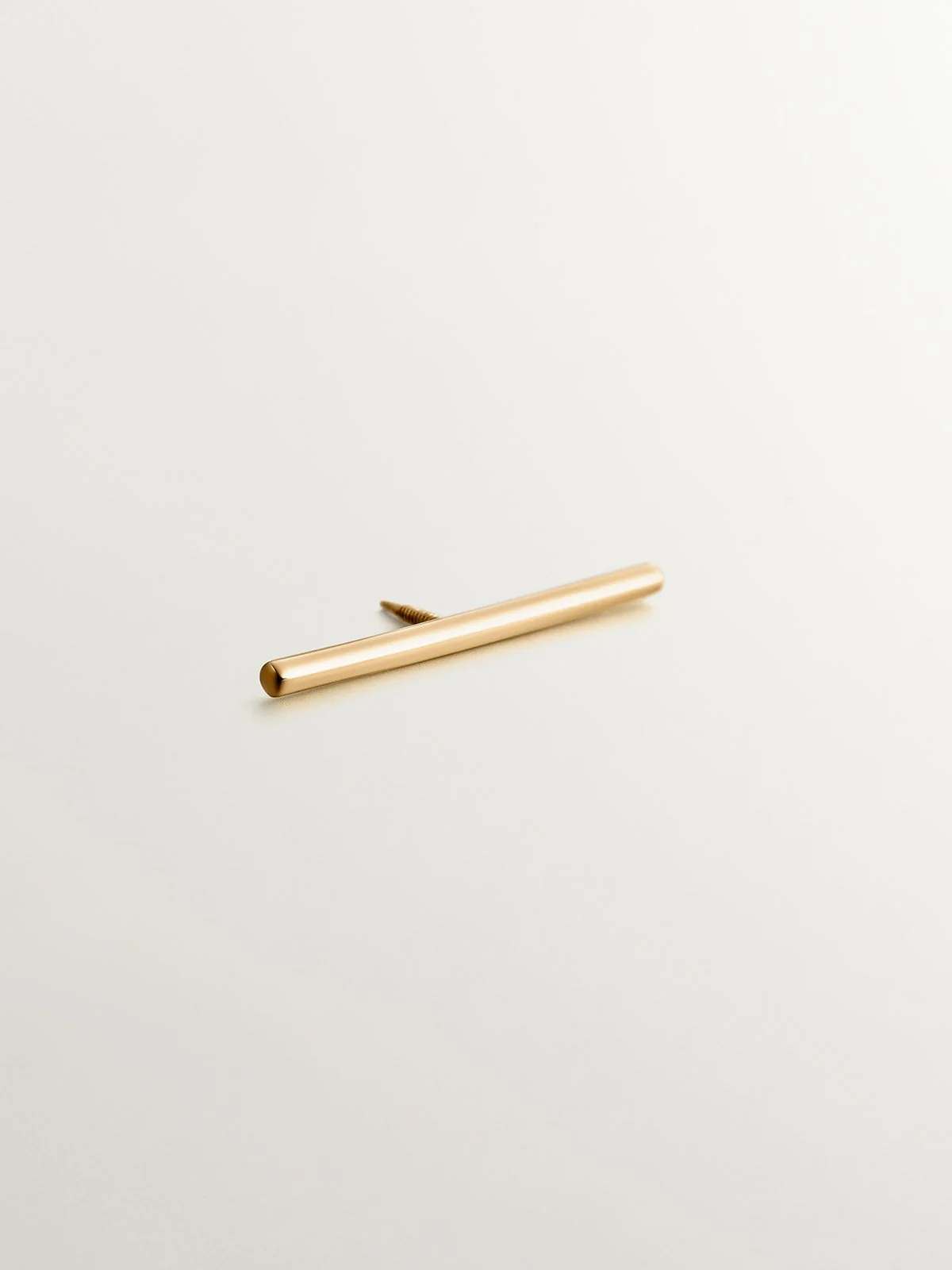 Piercing barra industrial de oro amarillo de 18K