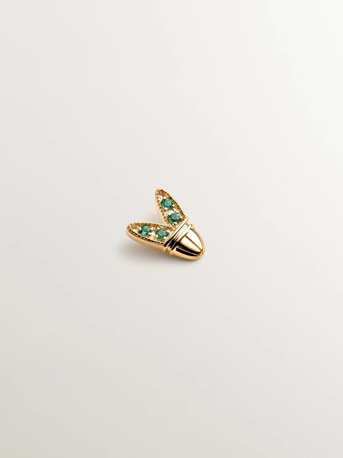 Piercing de oro amarillo de 18K con esmeraldas y forma de alas