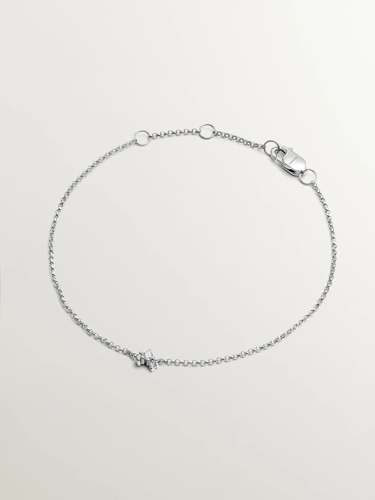 Pulsera de eslabones rolo de oro blanco de 9K con 3 diamantes
