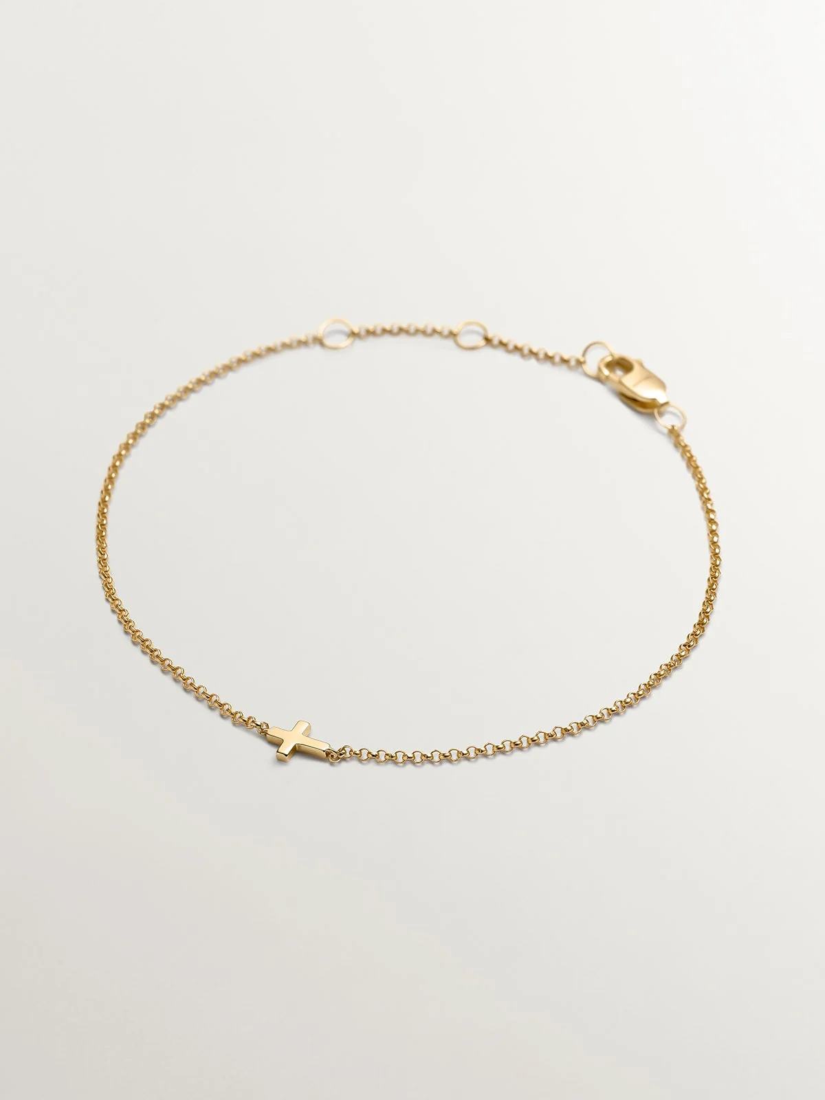 Pulsera de oro amarillo de 9K con cruz