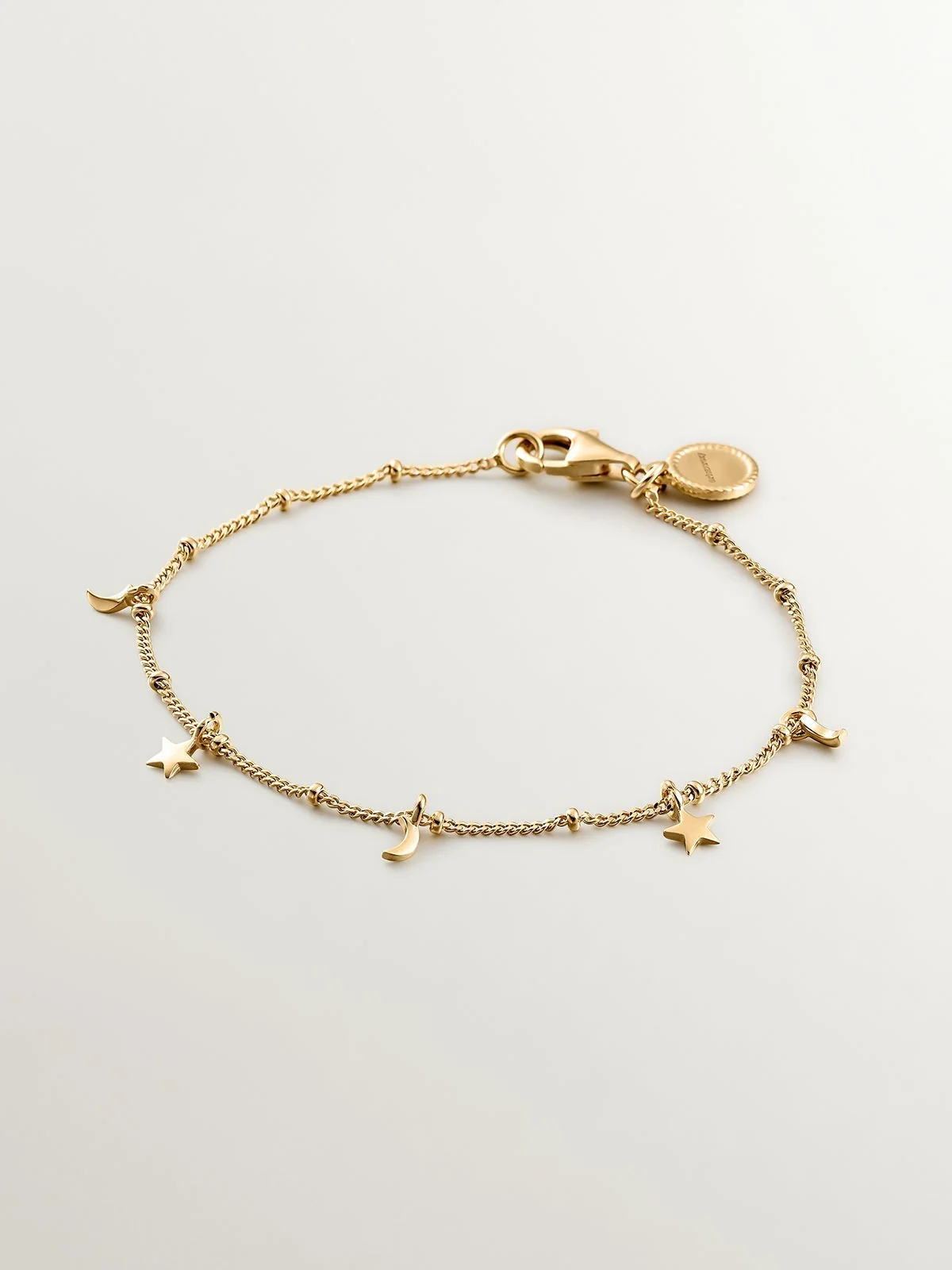 Pulsera de plata 925 bañada en oro amarillo de 18K con lunas y estrellas