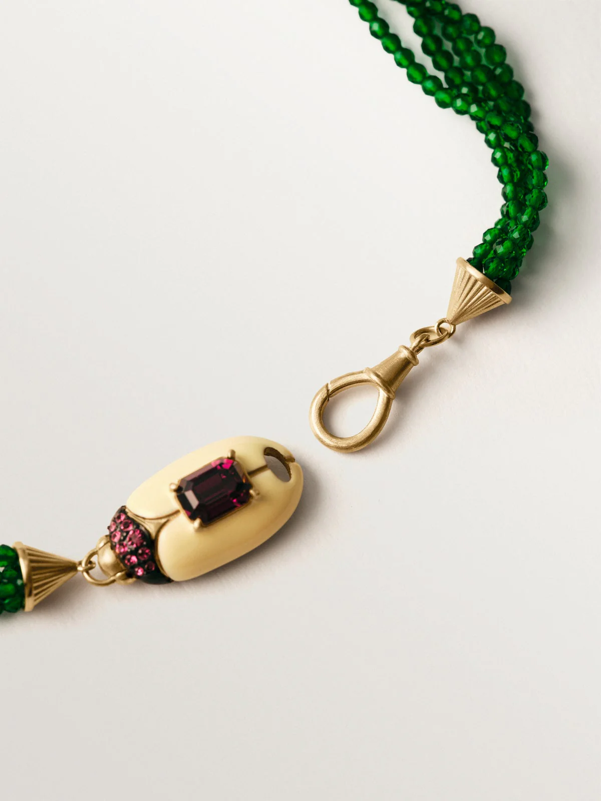 Yellow gold-plated necklace with green crystal beads and beetle shape with purple crystals - Image 7